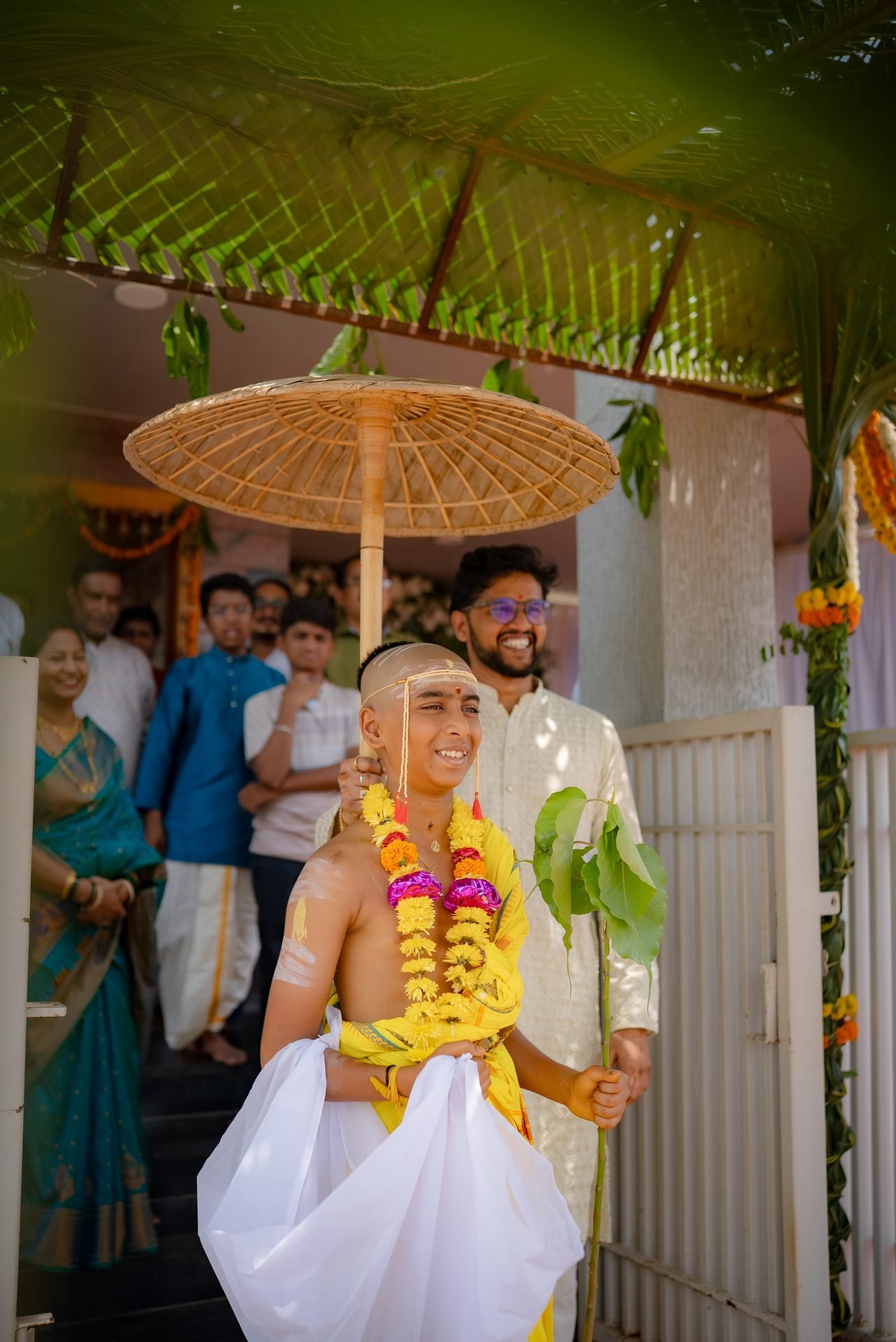 Couple Under Ceremonial Umbrella